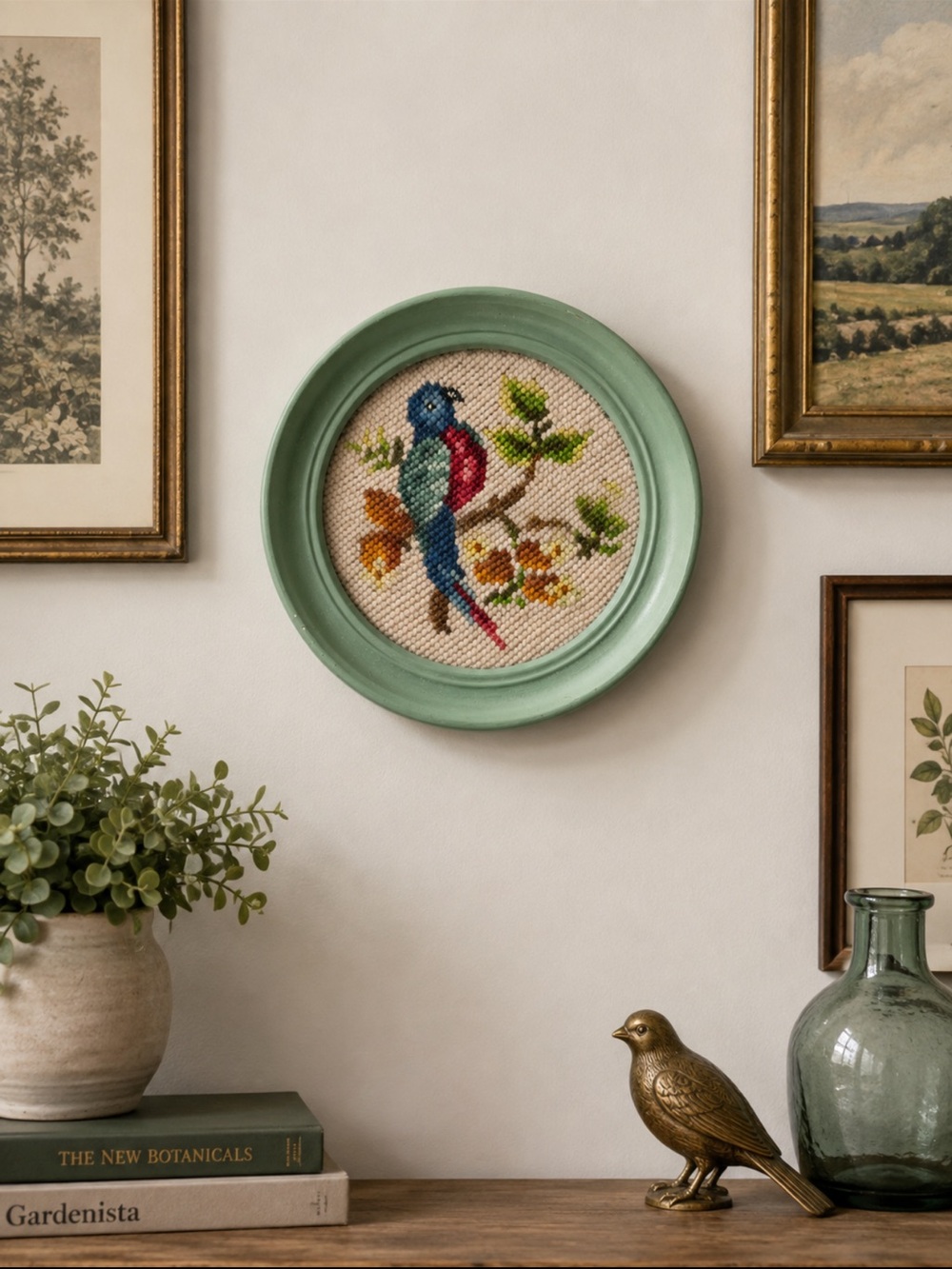 vintage needlepoint  embroidery featuring a colorful bird on a branch 1972 green